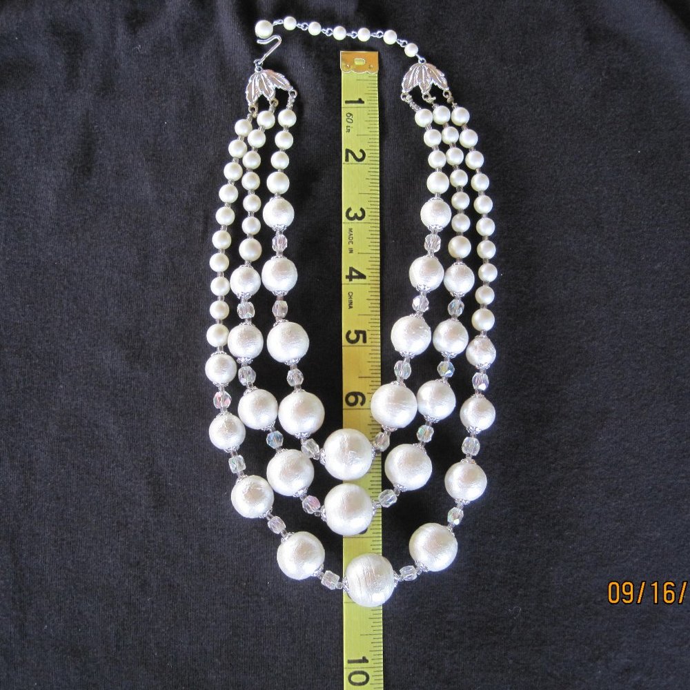 Vintage triple strand of white graduated round beads and smaller clear beads